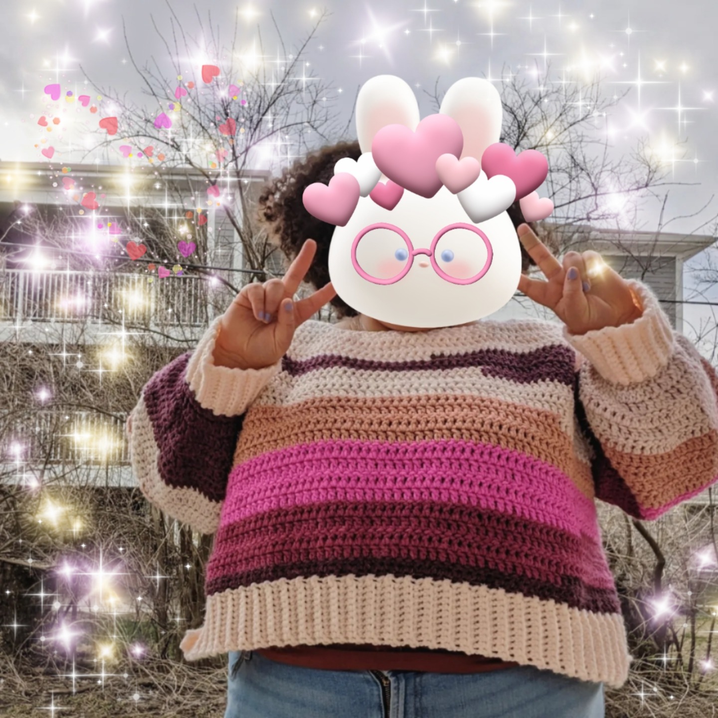 Crocheted sweater with a pink and white color paletter